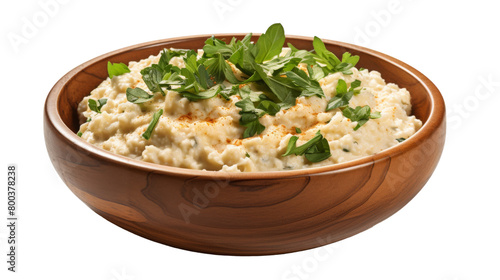 Creamy mashed potatoes in a bowl, adorned with vibrant green herbs on transparent background