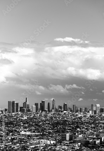 Skyline of downtown Los Angeles, California (USA) on a cloudy spring afternoon seen from Griffith Observartory viewpoint. Hollywood panorama with dramatic cloudscape, skycrapers. Black and white.