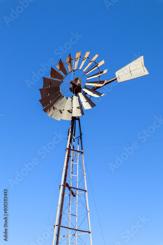 old windmill on sky background