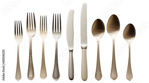 A collection of elegant silverware - forks, knives, and spoons - shining under the light on transparent background
