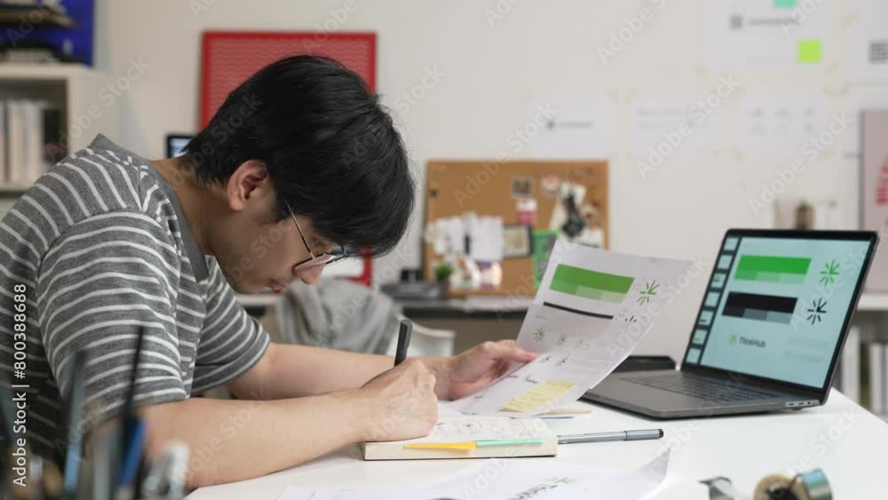 Young Asian Graphic designer working in office. Designing logo Artist Creative Designer Illustrator Graphic Skill Concept. Young Asian Graphic designer working in office. Designing logo Artist Creative Designer Illustrator Graphic Skill Concept.