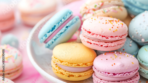A close-up image of a variety of colorful macarons arranged on a white plate. photo