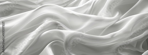 A close-up view of flowing white fabric with intricate details. photo