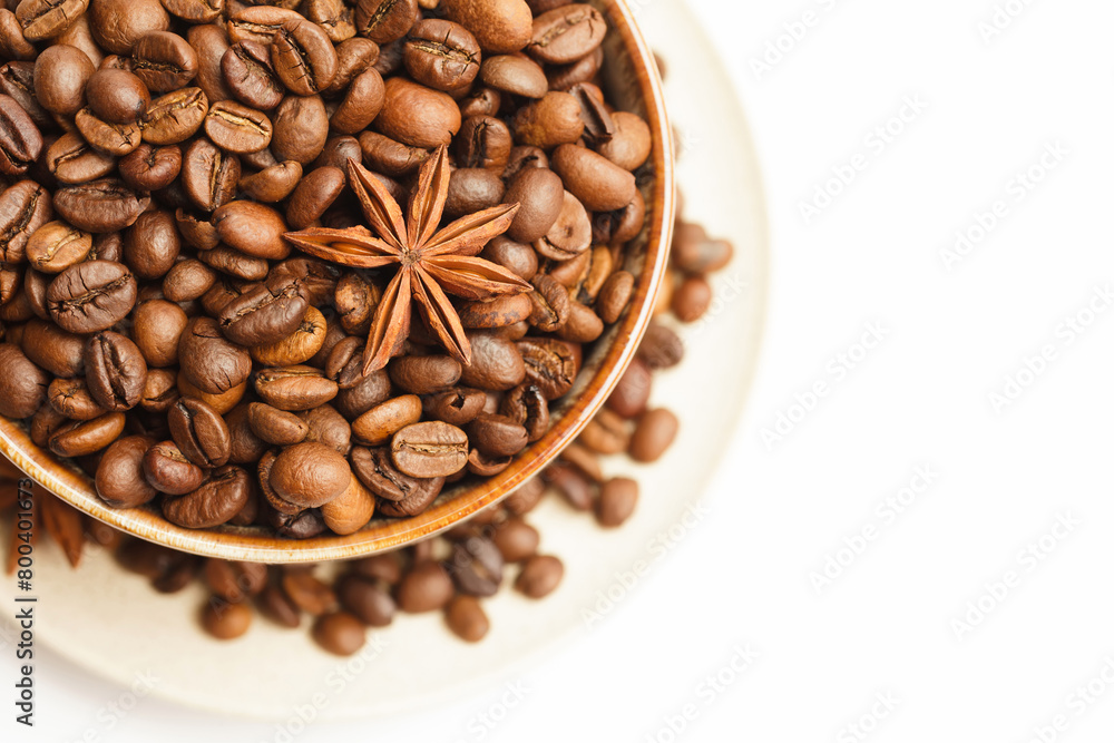 Fototapeta premium Cup with coffee beans and spices on white background. Top view