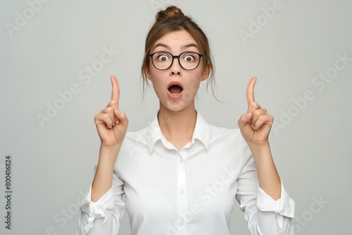 Wallpaper Mural Surprised businesswoman raising her index fingers Torontodigital.ca