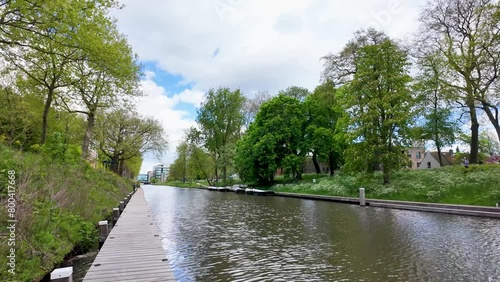 Utrecht Netherlands, City caputred on a sunny day with clouds. Utrecht city center river and channels with green trees photo