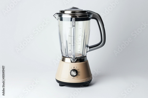 A blender with a powerful motor and a transparent lid with a removable filler cap for easy ingredient monitoring isolated on a solid white background.