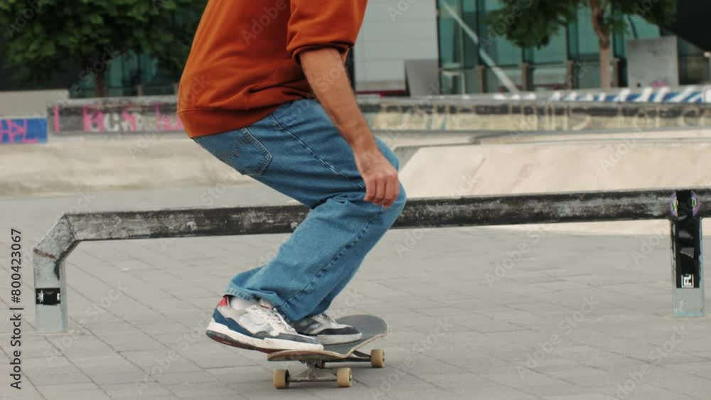 Young skater making 360 flip jump, performing kickflip trick, skateboarder training in skatepark, making tricks, slides and flips, professional extreme sport athlete training ride on skateboard. Young skater making 360 flip jump, performing kickflip trick, skateboarder training in skatepark, making tricks, slides and flips, professional extreme sport athlete training ride on skateboard.