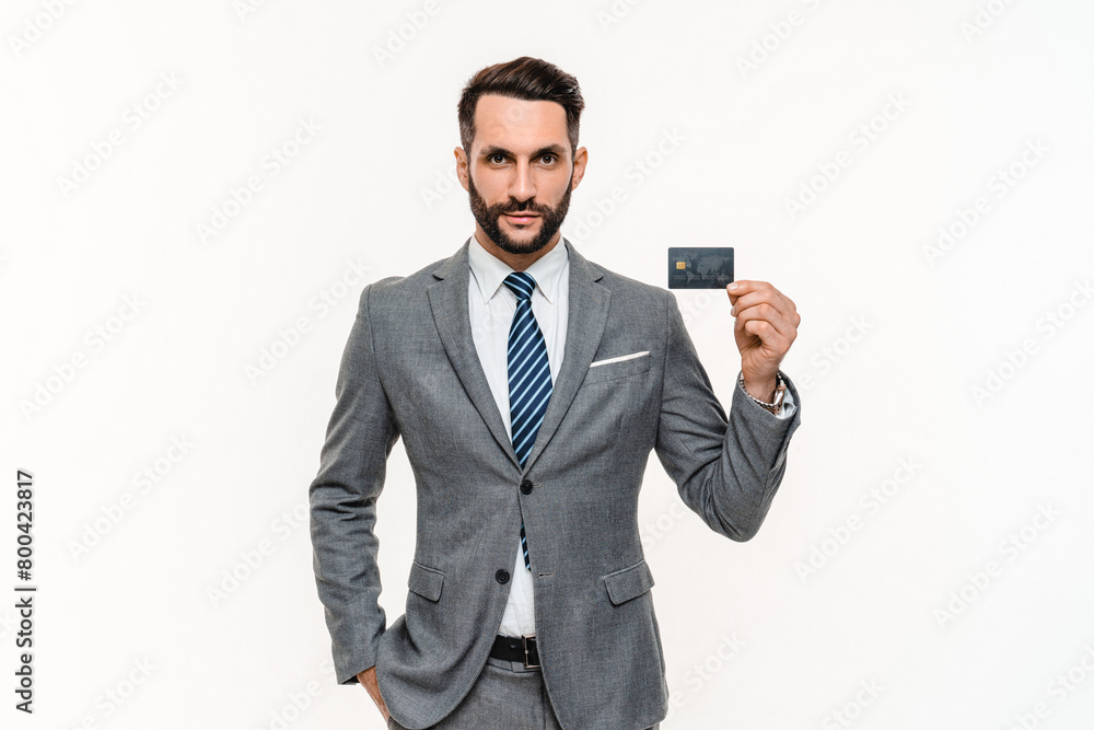 Confident young banker using credit card for online shopping isolated over white background. Happy manager businessman ceo boss doing e-banking e-commerce with debit card Confident young banker using credit card for online shopping isolated over white background. Happy manager businessman ceo boss doing e-banking e-commerce with debit card