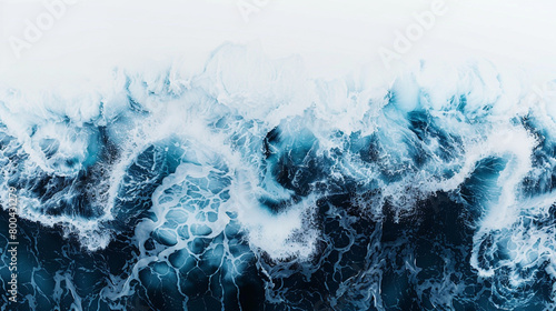 A powerful and majestic ocean wave, frozen in motion against a pristine white surface.