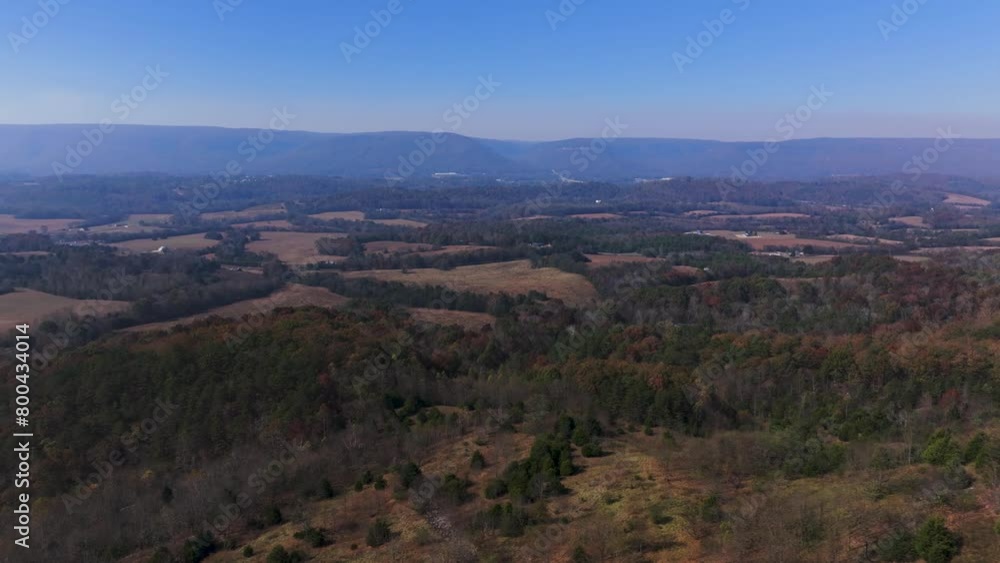Aerial drone shot of wide rural landscape with trees and mountain against clear blue sky at Eastern Kentucky Aerial drone shot of wide rural landscape with trees and mountain against clear blue sky at Eastern Kentucky