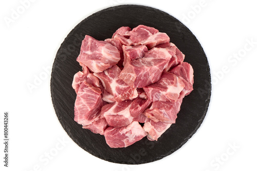 Raw pork pieces, isolated on white background. High resolution image