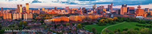 Panoramic aerial image of Manchester and Salford skyline showing the Meadow park on a sunset time.  photo