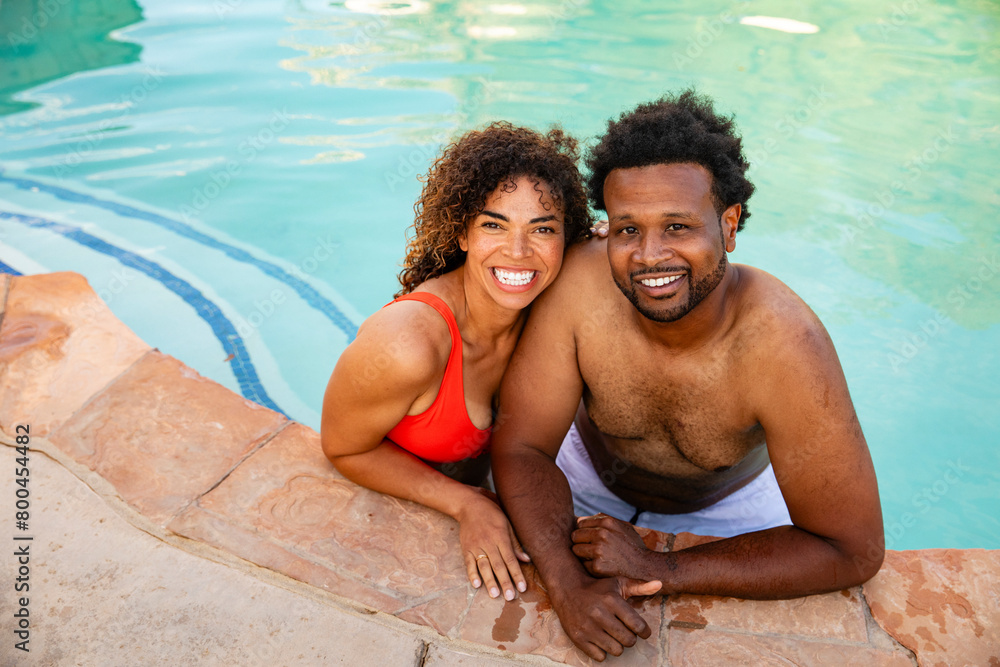 Happy Couple Looks At The Camera While In The Pool Happy Couple Looks At The Camera While In The Pool