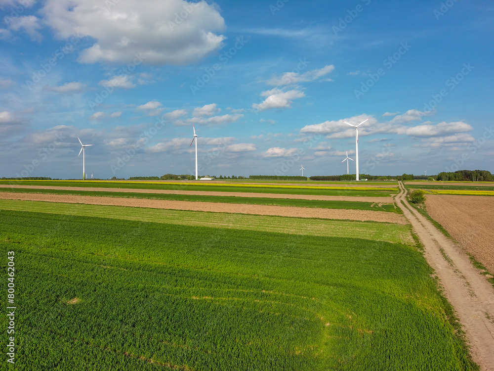 Spring farmland and electric windmills. Spring farmland and electric windmills.