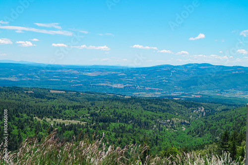 Aerial view of lush green valley seen from the top of Mount Ventoux in Provence region of southern France, Europe. Rural area in french alps. Between Monts de Vaucluse and the Dentelles de Montmirail photo