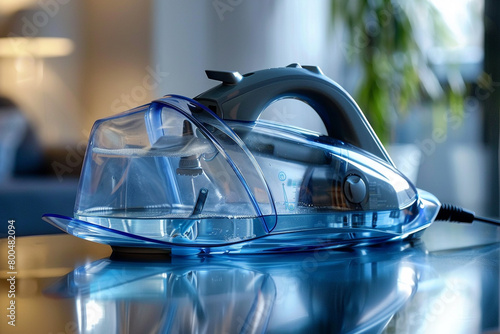 A modern steam iron with a transparent water tank, providing a clear view of the water level.