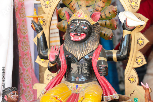Wooden Deity Nrsimha - avatar of Vishnu. Hindu God.