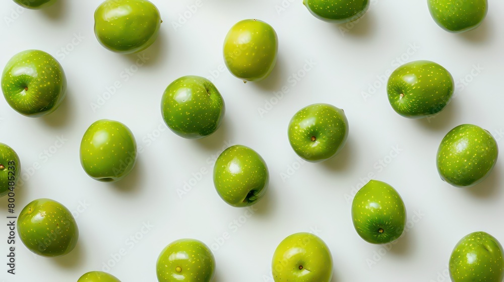 green olives scattered on a neutral background green olives scattered on a neutral background