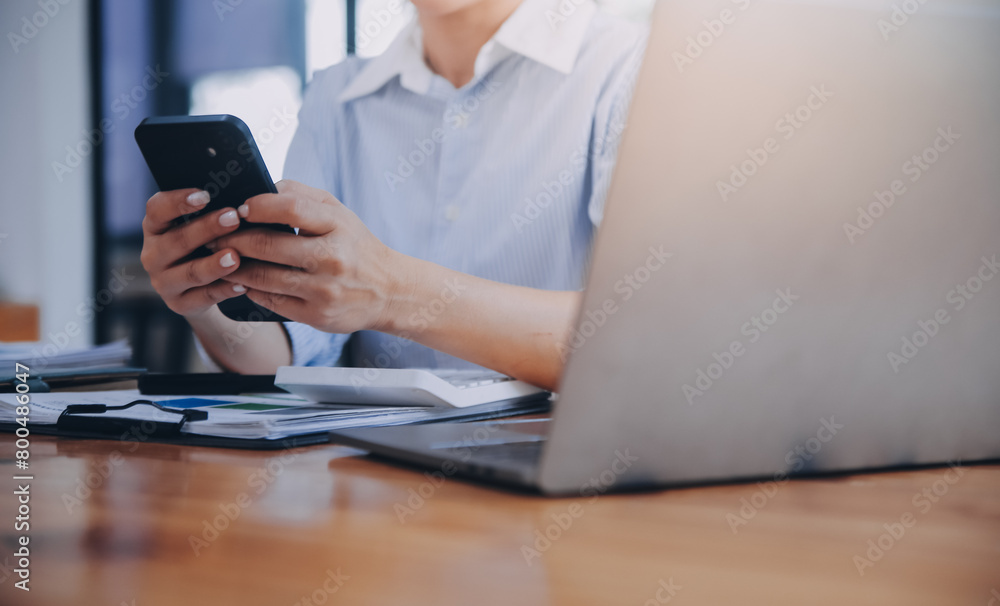 Portrait of a happy Asian businesswoman using mobile phone indoor, Asian businesswoman working in modern office. Portrait of a happy Asian businesswoman using mobile phone indoor, Asian businesswoman working in modern office.