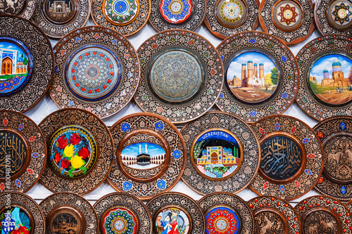 handmade Uzbek wooden gift plates hand-painted oriental patterns in the souvenir market of Uzbekistan in Tashkent