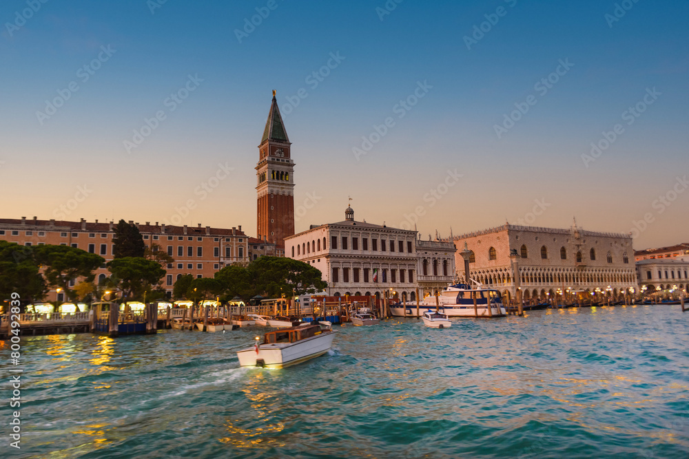 Fototapeta premium View of the gondolas of the Grand Canal on a sunny day in Venice, Italy. Night shot.