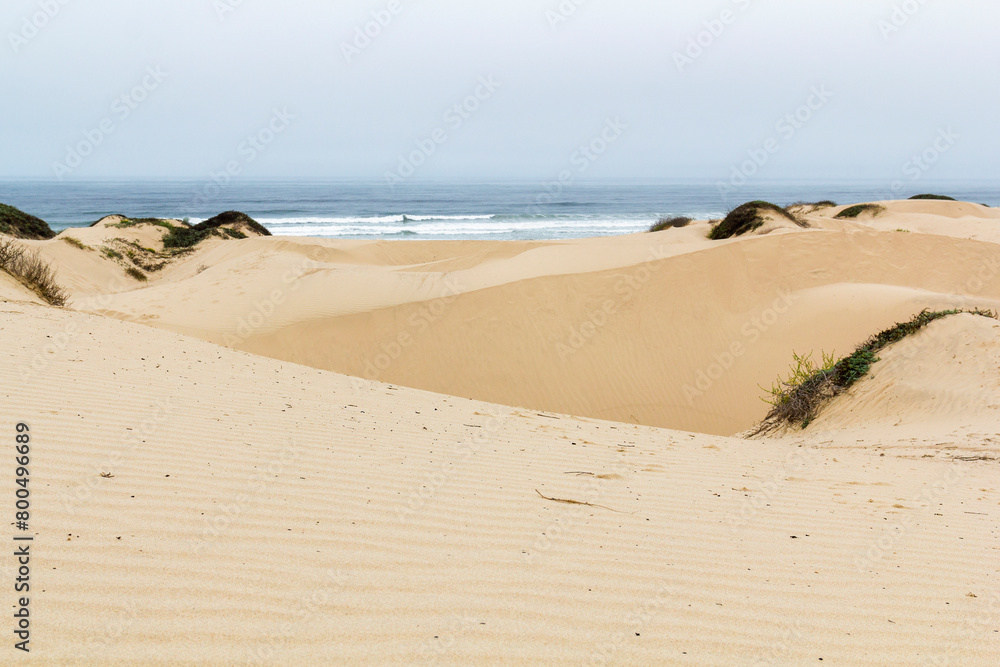 the famous ocean dunes at a cloudy morning day. Pier Ave of Oceano, California the famous ocean dunes at a cloudy morning day. Pier Ave of Oceano, California