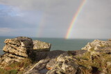 rainbow over the sea from the cliffs in boscastle cornwall