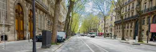 Serene spring day on a European city street lined with budding trees and historic architecture, embodying urban renewal and Earth Day concepts