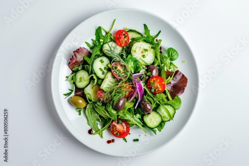 healthy mixed salad on a white plate isolated on a white background