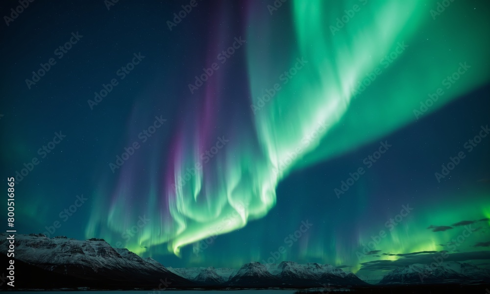 Aurora borealis, northern lights over mountains in winter, Iceland Aurora borealis, northern lights over mountains in winter, Iceland