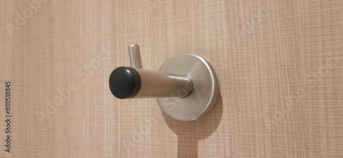 Door stopper wall. Stainless magnetic door in toilet photo