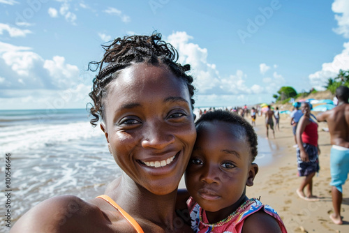 Mother and daughter on the beach self portrait photo