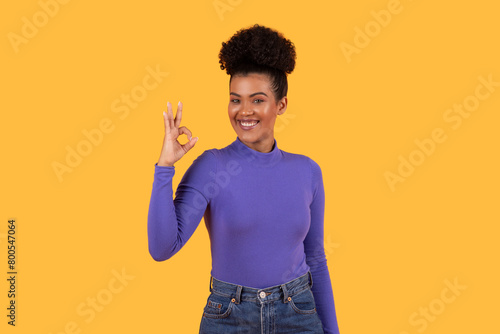 Woman in Purple Shirt Making Okay Gesture