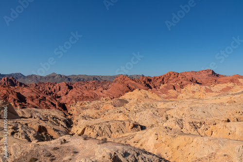 Scenic view of from Silica Dome viewpoint overlooking the Valley of Fire State Park in Mojave desert  Nevada  USA. Landscape of Aztek sandstone rock formations. Hot temperature in arid vegetation