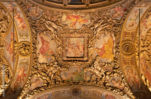 MILAN, ITALY - MARCH 5, 2024: The baroque ceiling with the frescoes (prophets and patriarch) in the side nave of church Chiesa di San Vittore al Corpo.  photo