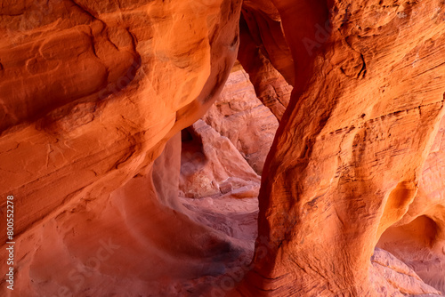 Interior view of windstone arch or fire cave in Valley of Fire State Park in Mojave desert near Las Vegas, Nevada, USA. Unique red Aztek sandstone rock formation in remote location. Good light