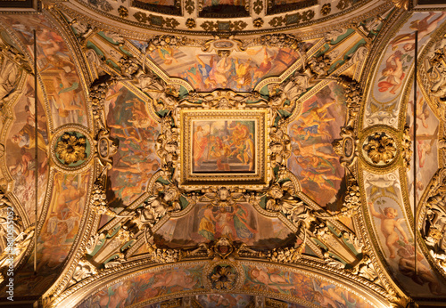 MILAN, ITALY - MARCH 5, 2024: The baroque ceiling with the frescoes from Live of early-christian martyr in the side nave of church Chiesa di San Vittore al Corpo.  photo