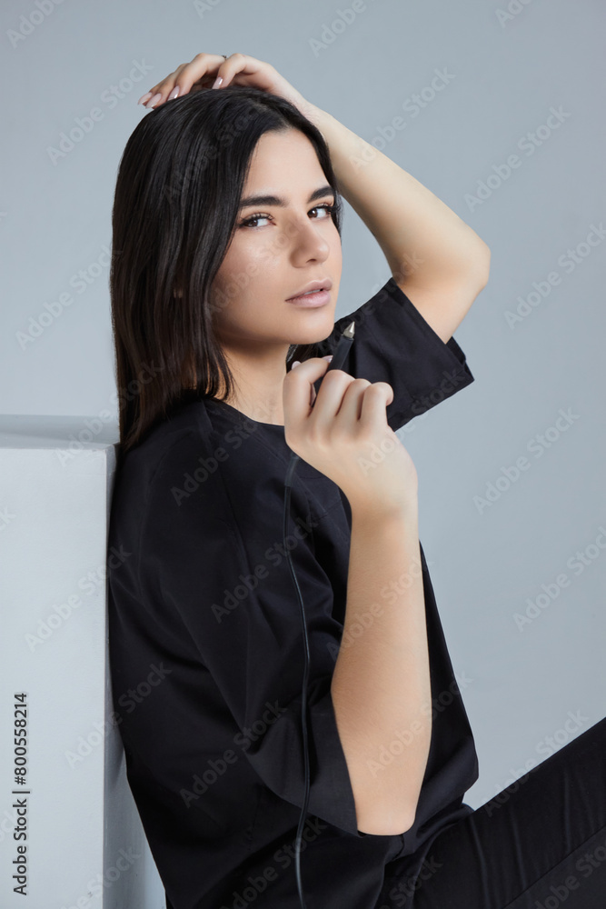 Fototapeta premium master of electroepilation in a dark suit