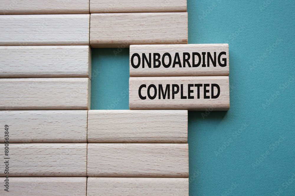 Onboarding Completed symbol. Concept word Onboarding Completed on wooden blocks. Beautiful grey green background. Business and Onboarding Completed concept. Copy space Onboarding Completed symbol. Concept word Onboarding Completed on wooden blocks. Beautiful grey green background. Business and Onboarding Completed concept. Copy space
