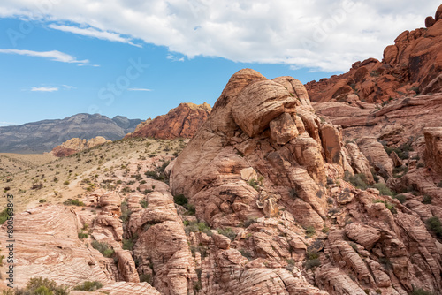 Scenic view of Aztec sandstone slickrock outcrop on the Calico Hills Tank Trail, Red Rock Canyon National Conservation Area in Mojave Desert near Las Vegas, Nevada, United States, USA. Rock climbing photo