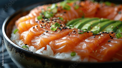  A plate of sushi and avocado, beautifully garnished with black sesame seeds