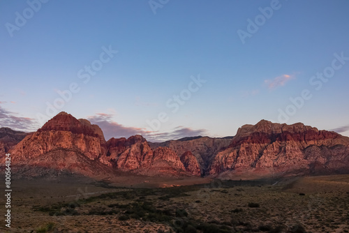 Scenic sunrise view of limestone peaks Mount Wilson  Bridge and Rainbow Mountain of Red Rock Canyon National Conservation Area in Mojave Desert near Las Vegas  Nevada  United States. Remote hiking