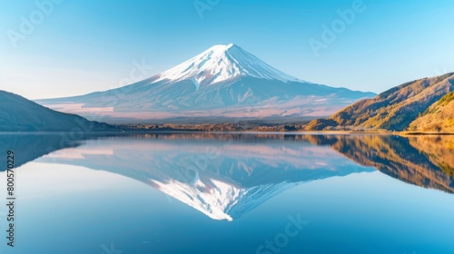 A serene landscape featuring Mount Fuji reflected in the tranquil waters of a pristine lake, capturing the mountain's iconic symmetry and grace.