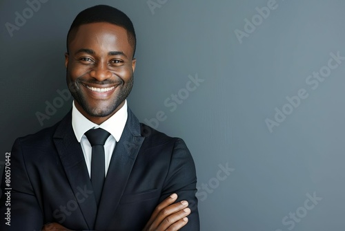 charismatic african american businessman with toothy smile exuding confidence and success studio portrait photo