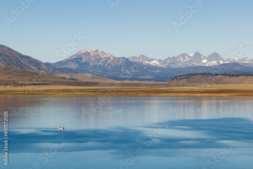 panoramic view over the Crowley lake to a iconic mountain range at a bright sunny summer day, California photo