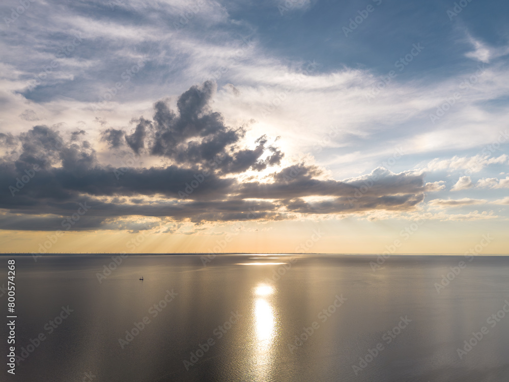 Aerial drone image of clouds reflecting in a lake during sunset, dramatic skies and colourful reflection Aerial drone image of clouds reflecting in a lake during sunset, dramatic skies and colourful reflection
