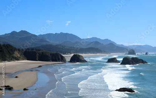 View from Ecola State Park Viewpoint overlooking Crescent Beach and in the distance Canon Beach with its famous Haystack Rock - Oregpn, Pacific Northwest photo