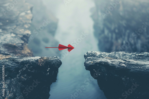 A red arrow leaping over a gap between cliffs, showcasing risk-taking and the leap of faith required to overcome fears 