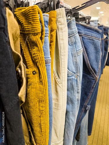 Corduroy pants and jeans on a sales rack